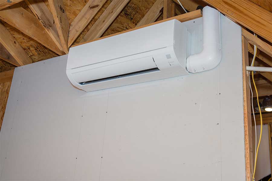 Wall-mounted ductless mini split system installed in an unfinished room in Huntington WV